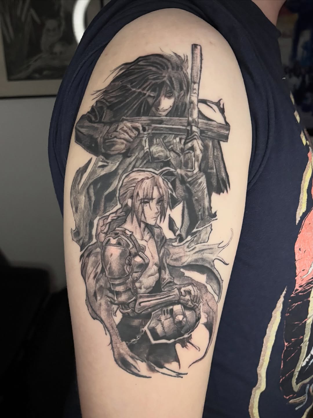 Upper arm piece — Alucard from Hellsing looms above Edward Elric from Fullmetal Alchemist in a dramatic black & grey composition with dynamic flowing linework.